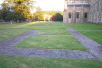 The site of the Old Minster is outlined in brick in the grass to the North side of the present cathedral.