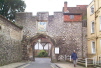The 16th Century Priory Gate, with it's nail studded doors and inset pedestrian gate, is surmounted by a tiny house, the Porters Lodge, once occupied by the Cathedral Organist.